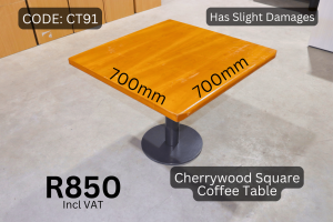 Used cherrywood coffee table supplied by HNA Office Furniture in Gauteng.